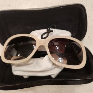 Chanel sunglasses in cream and black with little bows on sides